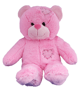 An adorable pink patches fluffy teddy bear with a heart shaped patch on its head, tummy and one foot