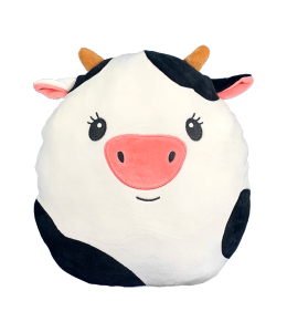 a cute cow squishie pillow in white with black spots