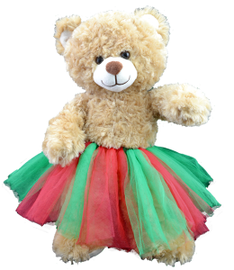Christmas colored red and green tutu dressed on a light brown plush toy bear