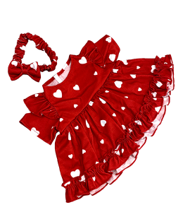 red dress with white hearts printed on it and a headband with a bowtie