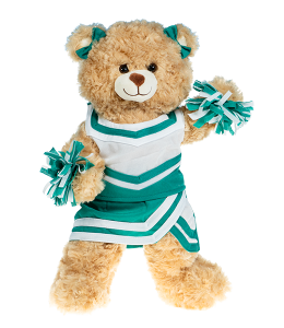 Light cream colored bear in a green and white cheerleading uniform with poms in paws and bowties on the ears