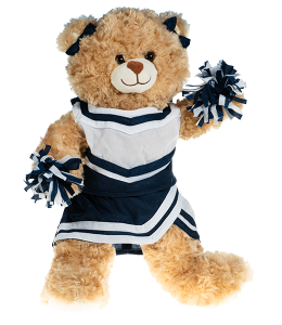 Small light cream colored bear in a navy and white cheerleading uniform with poms in paws and bowties on the ears