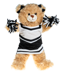 Light cream colored bear in a black and white cheerleading uniform with poms in paws and bowties on the ears