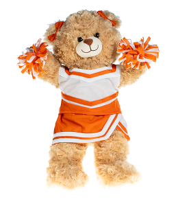 Light cream colored bear in a orange and white cheerleading uniform with poms in paws and bowties on the ears