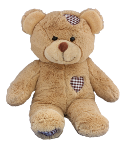 Adorable cuddly brown teddy bear with heart shaped patches on the head and on the chest