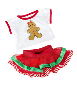 White shirt with red accents and gingerbread cookie print, paired with red dress and green accents