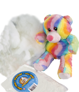 fiber filling and vacuum sealed fiber pack next to a rainbow bear