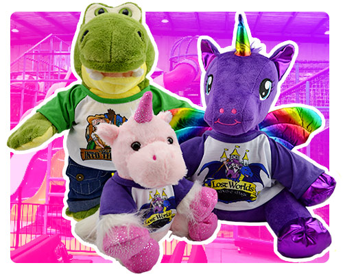 3 plush toy animals over a purple background