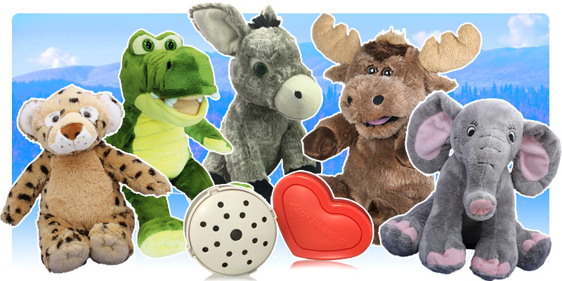 Selection of Plush Toys sitting around recordable modules against a blue background