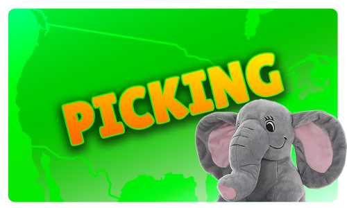 picking text over a green background and a plush toy elephant